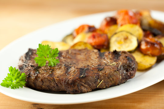 Gourmet grilled steak with baked vegetables