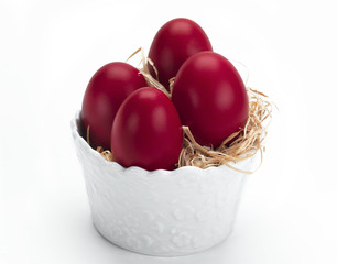 red eggs in a white bowl