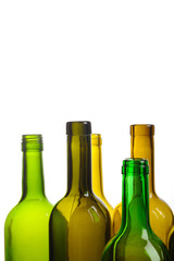 Many empty green wine bottles isolated on white background