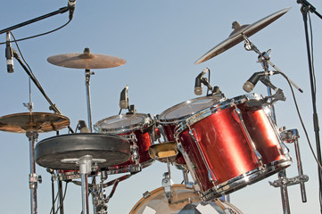 Drumkit against a blue sky background
