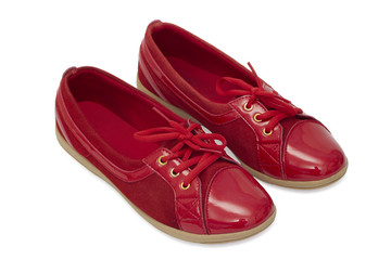 Red shiny shoes on white background.