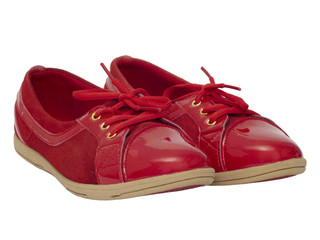 Red shiny shoes on white background.
