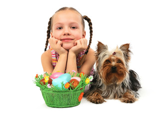 Little girl with easter eggs and dog