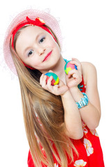 beautiful little girl with easter eggs isolated on white
