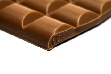 Close up of chocolate piece, on white background