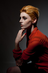 Beautiful portrait of pretty young female with red hair