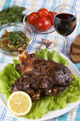 Roast leg of lamb on decorated table