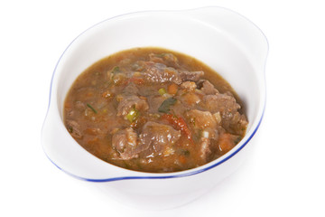 Meat stew with vegetables and herbs