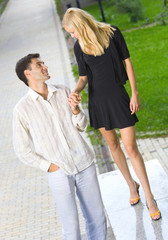 Young happy amorous couple together, outdoors