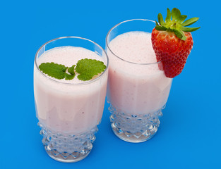 Strawberry milkshake on a blue background