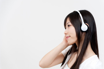 beautiful asian woman listening music