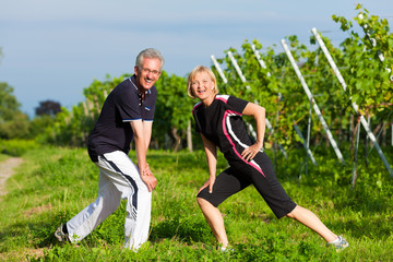 Mature couple doing sport outdoors