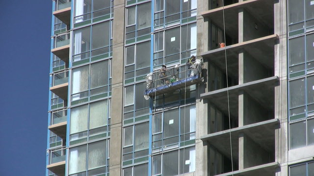 Construction Workers On New Highrise Building