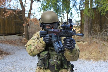 Fototapeta premium soldier with an assault rifle SA vz.58
