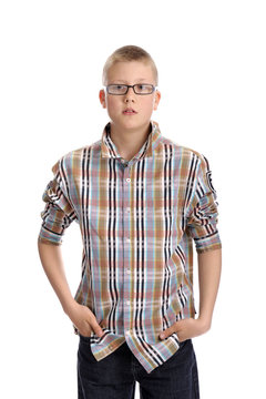 young boy , standing hands in his pockets