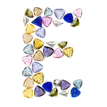 Gemstones alphabet, letter E. Isolated on white background.