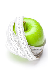 apple and measure tape isolated on white