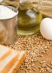 bakery products and basket on wood