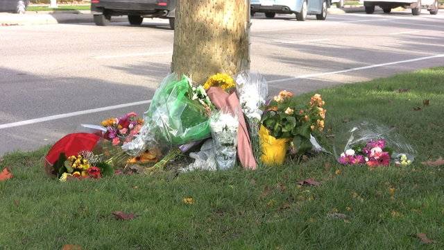 Accident Memorial With Traffic Passing By