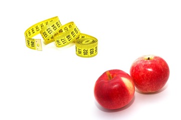 Measuring tape with red apples