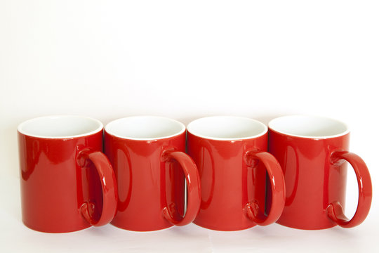 Four red cups on a white background