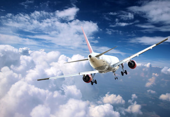 Big jet airplanes flying above clouds