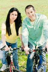 couple on bike relaxing outdoors happiness