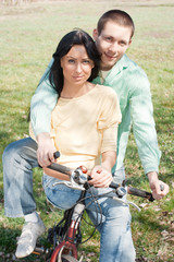 loving couple on bike outdoors