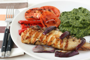 grilled red-fish with spinach and vegetables