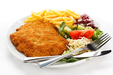 Pork chop, French fries and vegetables