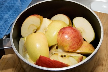 Cut apples in a medium sauce pot