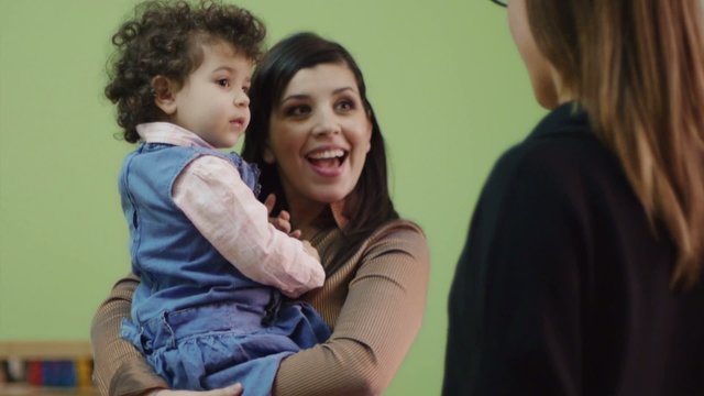 Educator And Mother With Little Girl At School