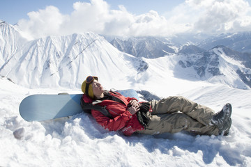 Girl sleeping on top of the mountain