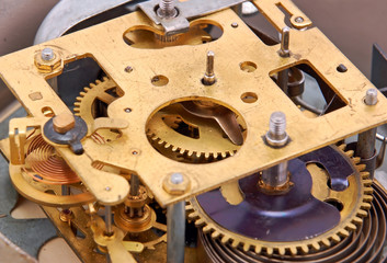 Inside the clock (watchwork), antique vintage clock mechanism