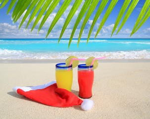 Beach cocktails with Santa christmas red winter hat