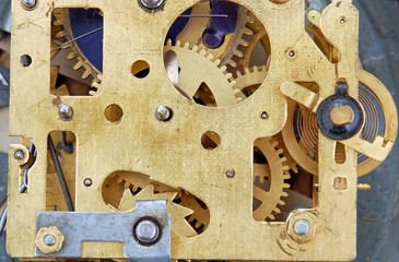 Inside the clock (watchwork), antique vintage clock mechanism