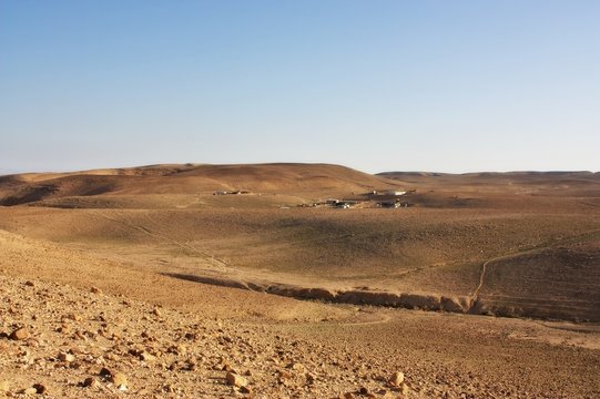 Desert mountains and a Bedouin village