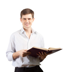 Smiling man with open book over white background.