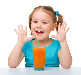 Little girl with orange juice