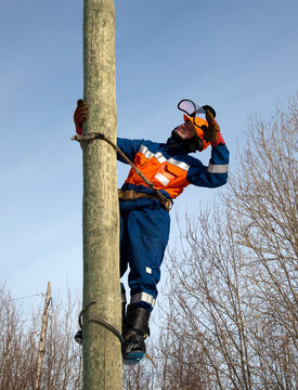 Electrician on a pole