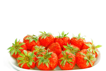 Dish of fresh strawberries with stalks