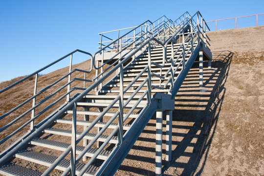 Stairway of stainless steel to the blue sky