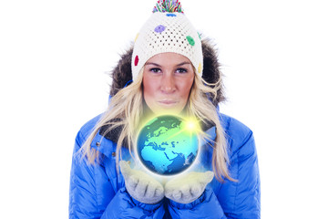 A beautiful young blonde woman holding a globe