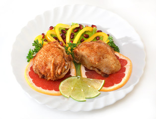 Fried chicken leg with lemon and cucumber