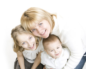 Fototapeta na wymiar Mother with kids.Happy Smiling Family over white