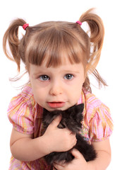 Little girl holding kitten