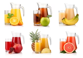 Fotobehang Set of jugs and glasses with tropical fruit juices isolated © Serhiy Shullye