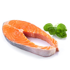 Salmon steak red fish decorated with basil