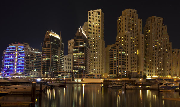 Town scape at night time. Panoramic scene, Dubai.