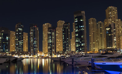 Fototapeta na wymiar Town scape at night time. Panoramic scene, Dubai.